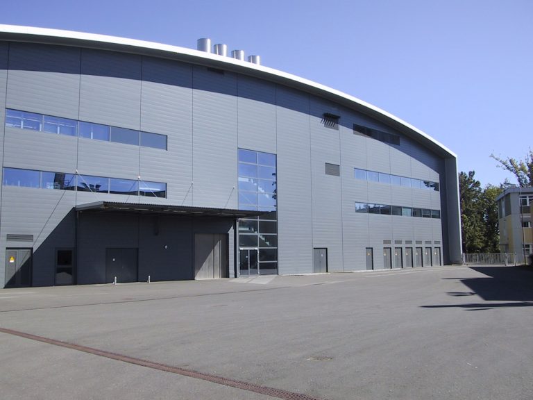 The Semiconductor Chip Race: Small Circuits, Global Stakes The exterior of a semiconductor fabrication plant building